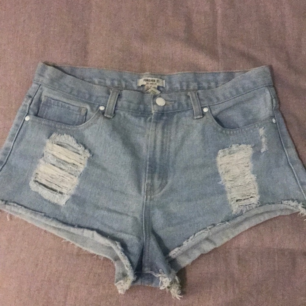 Distressed light jean shorts